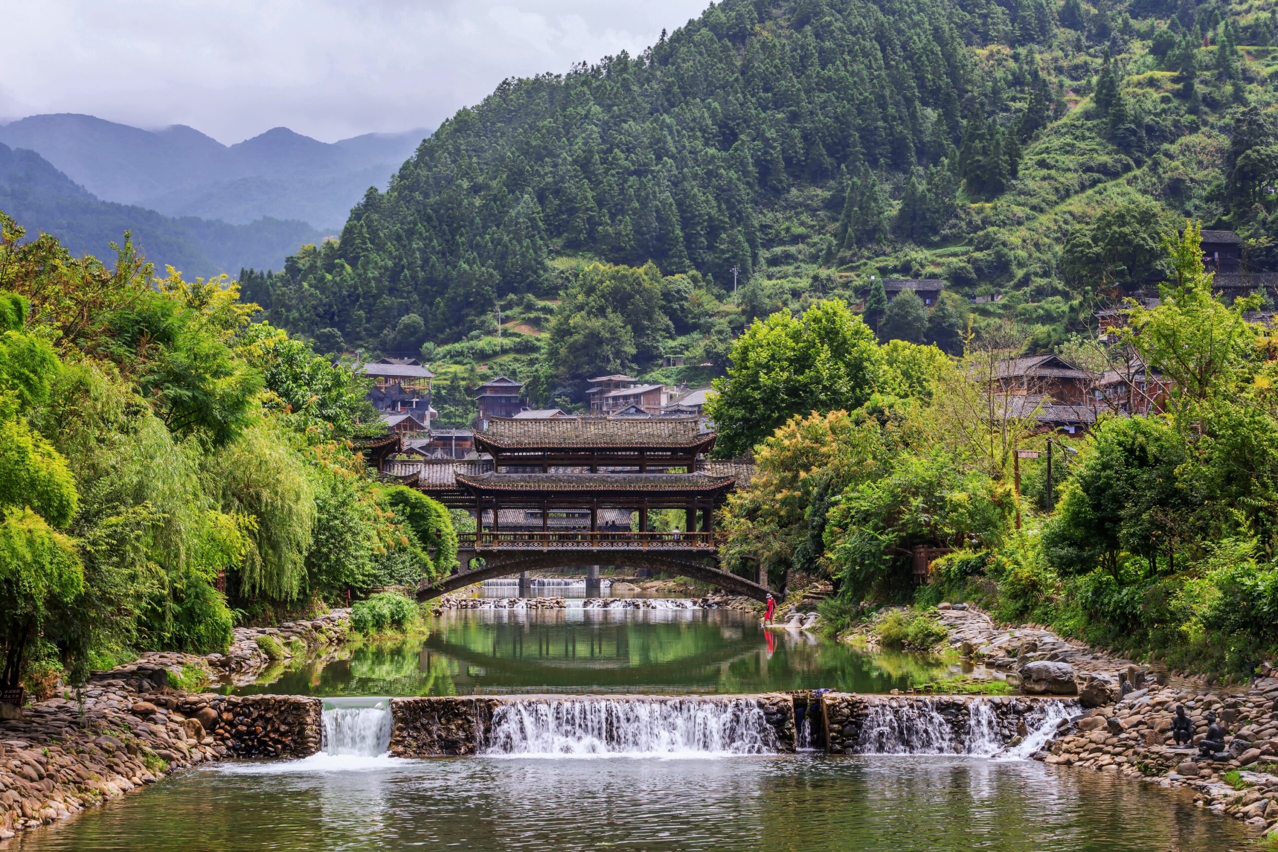 A scenic view of Qiandongnan Jingou Fengyuqiao